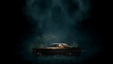 Promotional image for the film, It Follows, featuring a car with two people inside, centered in frame, on a dark night.